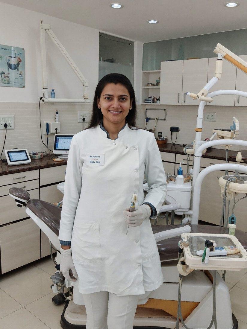Dr. Bhumi Patel performing precision dental treatment in Sola, Ahmedabad